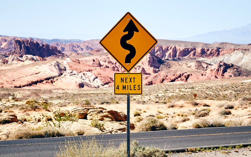 Regulatory signs - curvy road ahead