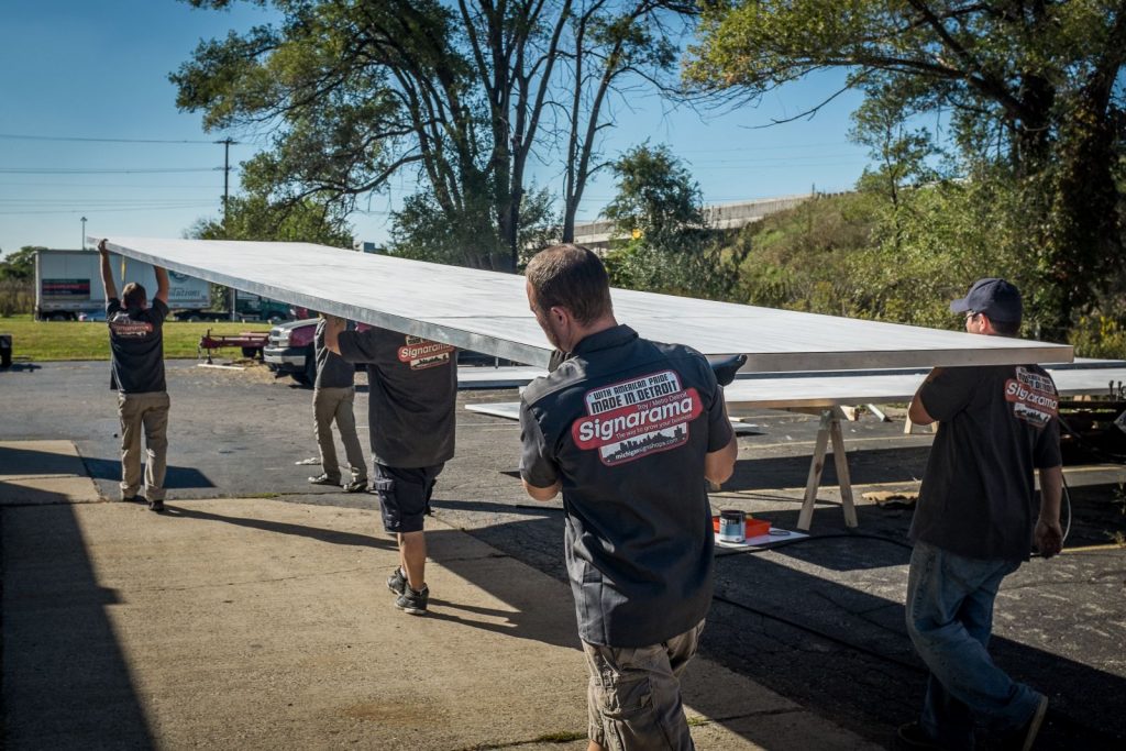 team working on a pylon sign