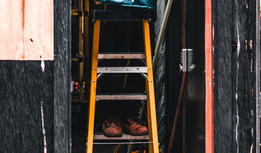 Person standing on ladder