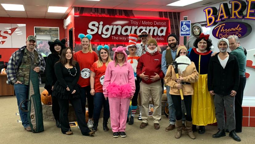 Signarama staff dressed up for a Halloween party