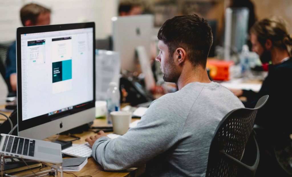 Man working on laptop in office