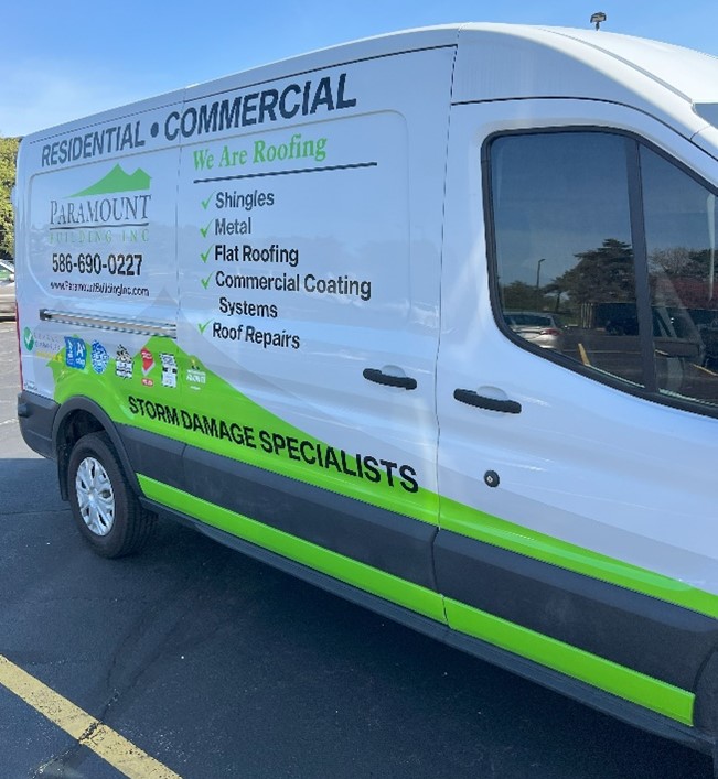 A work van with a custom neon green vehicle wrap