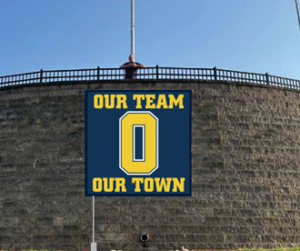 Oxford High School logo on top of a brick wall