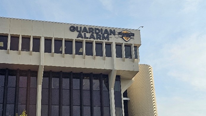 Exterior of an office building with a sign that says Guardian Alarm
