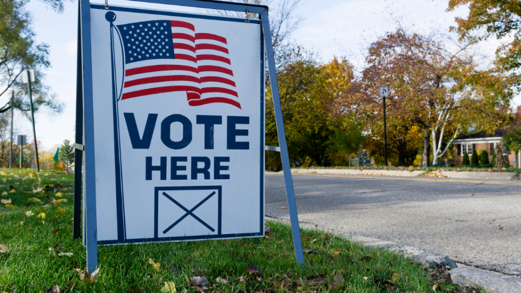 A "vote here" sign outside of a polling center